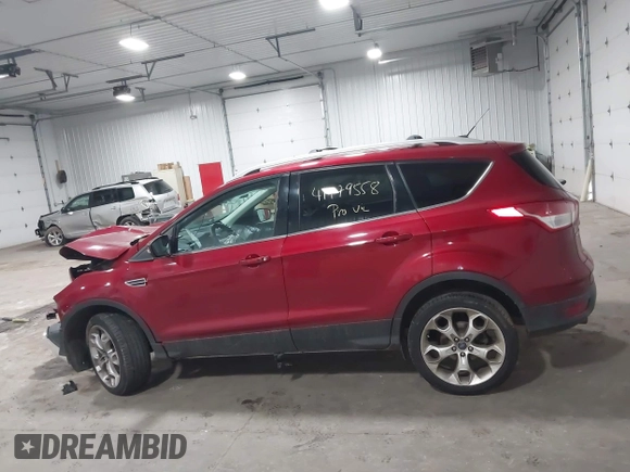 2013 Ford Escape Titanium with VIN 1FMCU9J98DUA72061, listed as a IAAI auction lot 41979558 with 176,667 mi miles and . Bid and sale history available at DreamBid. Image 14.