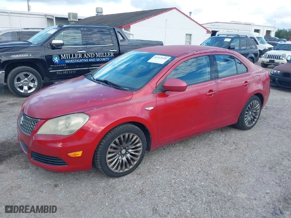 2012 Suzuki Kizashi SE with VIN JS2RE9A31C6101027, listed as a IAAI auction lot 41213426 with 174,490 mi miles. Bid and sale history available at carsss.com. Image 2.