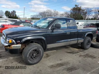 1999 Dodge Dakota SLT with VIN 1B7GG22Y5XS107729, listed as a Copart auction lot 79440034 with 163,718 mi miles and Salvage Title. Bid and sale history available at carsss.com. Image 1.