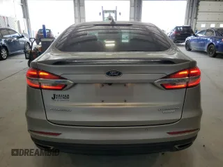 2020 Ford Fusion Titanium с VIN 3FA6P0K90LR112034, выставлен на аукционе Copart как лот 56740025 с пробегом 89 117 миль миль и Списание • Salvage title. История ставок и продаж доступна на DreamBid. Изображение 6.