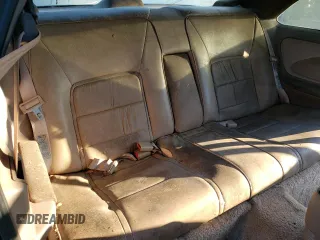 1995 Ford Thunderbird LX z VIN 1FALP62W0SH186954, wystawiony jako Copart lot #77611114 z przebiegiem 75 550 mil mil oraz Czysty tytuł • Clean title. Historia ofert i sprzedaży dostępna na DreamBid. Obrazek 10.