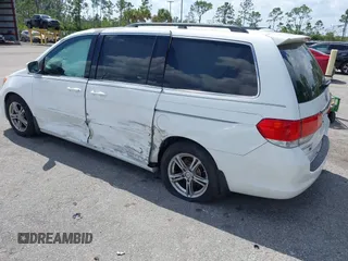 2008 Honda Odyssey Touring with VIN 5FNRL38858B006304, listed as a IAAI auction lot 41814309 with 208,778 mi miles. Bid and sale history available at carsss.com. Image 3.