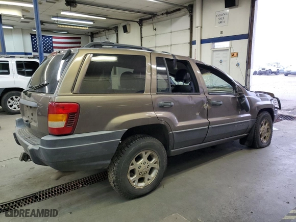 2001 Jeep Grand Cherokee Laredo with VIN 1J4GW48N01C529690, listed as a Copart auction lot 82037774 with 142,673 mi miles and Salvage Title. Bid and sale history available at carsss.com. Image 3.