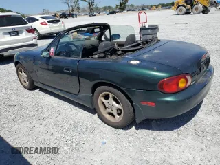 1999 Mazda MX-5 Miata with VIN JM1NB3530X0118452, listed as a Copart auction lot 53337575 with 150,574 mi miles and Clean title. Bid and sale history available at DreamBid. Image 2.