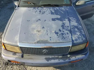 1992 Plymouth Acclaim z VIN 1P3XA46K8NF255561, wystawiony jako Copart lot #74290964 z przebiegiem 126 154 mil mil oraz Szkody całkowita. Historia ofert i sprzedaży dostępna na DreamBid. Obrazek 11.
