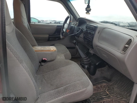 1999 Ford Ranger XLT with VIN 1FTZR15X2XTA58161, listed as a Copart auction lot 88077155 with 216,683 mi miles and Salvage Title. Bid and sale history available at carsss.com. Image 10.
