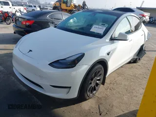 2023 Tesla Model Y Long Range with VIN 7SAYGAEE7PF766735, listed as a IAAI auction lot 41626651 with 21,983 mi miles. Bid and sale history available at carsss.com. Image 18.