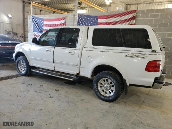 2001 Ford F-150 SuperCrew XLT with VIN 1FTRW08L21KE03150, listed as a Copart auction lot 67372004 with 184,124 mi miles and Salvage Title. Bid and sale history available at carsss.com. Image 2.