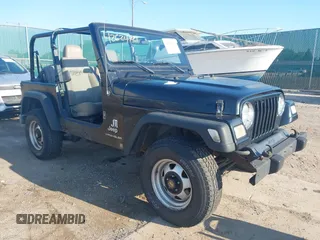 2004 Jeep Wrangler SE with VIN 1J4FA29144P797861, listed as a IAAI auction lot 42624721 with 156,867 mi miles and . Bid and sale history available at DreamBid. Image 1.