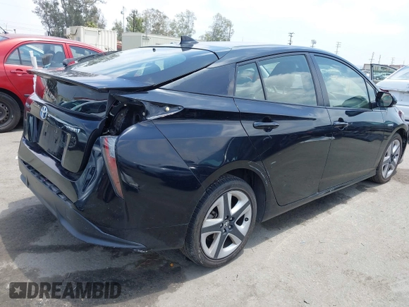 2017 Toyota Prius Two with VIN JTDKARFUXH3041668, listed as a IAAI auction lot 42421754 with 57,677 mi miles and . Bid and sale history available at DreamBid. Image 4.