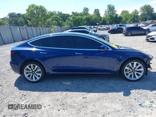2019 Tesla Model 3 Mid Range with VIN 5YJ3E1EA6KF402308, listed as a IAAI auction lot 40077902 with 89,794 mi miles and . Bid and sale history available at carsss.com. Image 13.