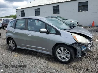 2009 Honda Fit Sport with VIN JHMGE88439S029286, listed as a Copart auction lot 63357784 with 112,705 mi miles and Salvage Title. Bid and sale history available at carsss.com. Image 4.