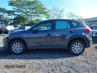 2014 Mazda CX-5 Sport with VIN JM3KE2BE8E0313407, listed as a IAAI auction lot 41215428 with 120,387 mi miles and . Bid and sale history available at carsss.com. Image 14.