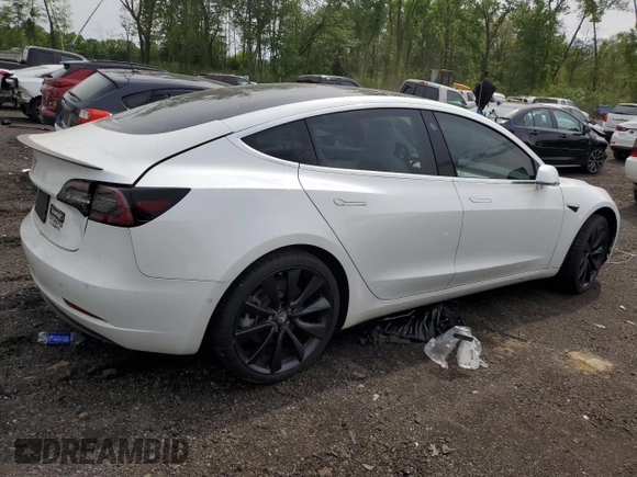 2019 Tesla Model 3 Mid Range z VIN 5YJ3E1EA2KF486532, wystawiony jako Copart lot #58082635 z przebiegiem 51 920 mil mil oraz Tytuł czysty. Historia ofert i sprzedaży dostępna na DreamBid. Obrazek 3.