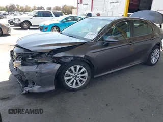 2019 Toyota Camry LE with VIN 4T1B11HK8KU204599, listed as a IAAI auction lot 42096889 with 76,518 mi miles and . Bid and sale history available at DreamBid. Image 2.