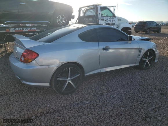 2004 Hyundai Tiburon GT with VIN KMHHN65F44U130202, listed as a Copart auction lot 43193404 with 207,694 mi miles and Salvage Title. Bid and sale history available at carsss.com. Image 3.
