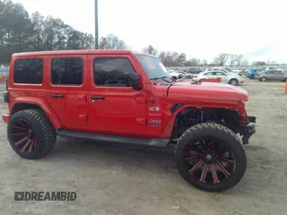 2022 Jeep Wrangler Unlimited Sahara with VIN 1C4JJXP62NW136932, listed as a IAAI auction lot 41486025 with 36,986 mi miles and . Bid and sale history available at DreamBid. Image 14.