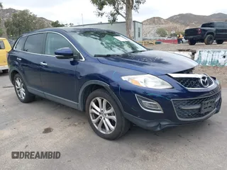 2011 Mazda CX-9 Grand Touring z VIN JM3TB2DV2B0306121, wystawiony jako IAAI lot #42193190 z przebiegiem 138 022 mil mil oraz . Historia ofert i sprzedaży dostępna na DreamBid. Obrazek 1.