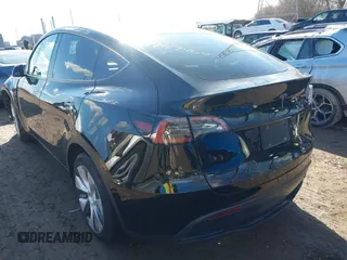 2024 Tesla Model Y with VIN 7SAYGDED5RF093018, listed as a IAAI auction lot 41747467 with 60,469 mi miles and . Bid and sale history available at DreamBid. Image 3.
