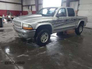 2004 Dodge Dakota SLT with VIN 1D7HG48N64S523528, listed as a IAAI auction lot 41199575 with 261,239 mi miles. Bid and sale history available at carsss.com. Image 2.