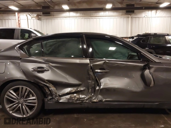 2014 Infiniti Q50 Premium with VIN JN1BV7ARXEM699902, listed as a IAAI auction lot 42135410 with 103,929 mi miles and . Bid and sale history available at DreamBid. Image 6.