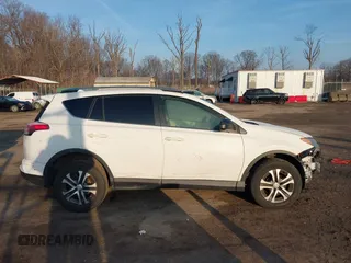 2017 Toyota RAV4 LE with VIN JTMZFREV7HJ120317, listed as a IAAI auction lot 41166489 with 144,799 mi miles and . Bid and sale history available at carsss.com. Image 14.