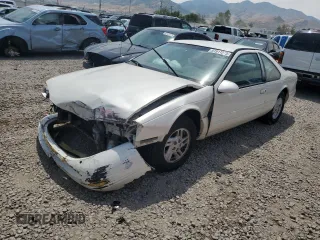 1996 Ford Thunderbird LX z VIN 1FALP6248TH120488, wystawiony jako Copart lot #61911275 z przebiegiem 224 056 mil mil oraz Szkoda całkowita • Salvage title. Historia ofert i sprzedaży dostępna na DreamBid. Obrazek 1.