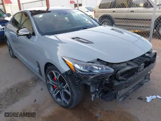 2020 Kia Stinger GT2 with VIN KNAE55LC1L6075699, listed as a IAAI auction lot 41598898 with 58,894 mi miles. Bid and sale history available at carsss.com. Image 1.