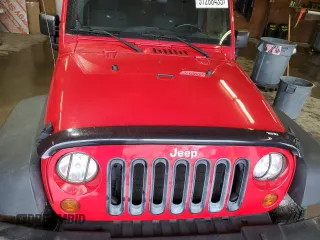 2012 Jeep Wrangler Unlimited Sport z VIN 1C4HJWDG2CL117124, wystawiony jako Copart lot #57288435 z przebiegiem 134 860 mil mil oraz Czysty tytuł • Clean title. Historia ofert i sprzedaży dostępna na DreamBid. Obrazek 12.