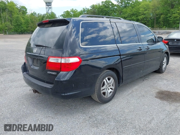 2005 Honda Odyssey EX-L with VIN 5FNRL38775B085512, listed as a IAAI auction lot 42128261 with Not Provided miles and . Bid and sale history available at DreamBid. Image 4.