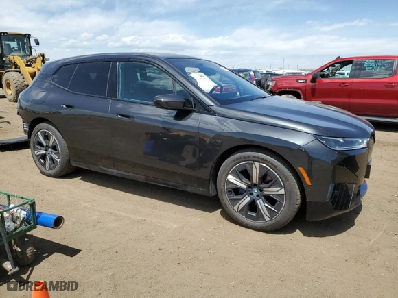 2023 BMW iX xDrive50 with VIN WB523CF03PCM09655, listed as a Copart auction lot 52922124 with 3,159 mi miles. Bid and sale history available at carsss.com. Image 4.