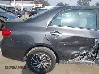 2011 Toyota Corolla L with VIN JTDBU4EE3BJ090749, listed as a IAAI auction lot 42106633 with 209,824 mi miles. Bid and sale history available at carsss.com. Image 19.