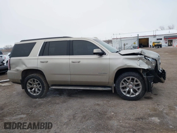 2015 GMC Yukon SLT z VIN 1GKS2BKC6FR655777, wystawiony jako IAAI lot #40982330 z przebiegiem 120 627 mil mil oraz . Historia ofert i sprzedaży dostępna na DreamBid. Obrazek 14.