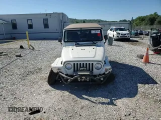 2000 Jeep Wrangler Sahara with VIN 1J4FA59SXYP764539, listed as a Copart auction lot 52707385 with 136,159 mi miles and Salvage title. Bid and sale history available at DreamBid. Image 11.