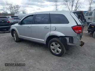 2013 Dodge Journey SE with VIN 3C4PDCAB9DT532554, listed as a IAAI auction lot 42026129 with 164,599 mi miles. Bid and sale history available at carsss.com. Image 3.