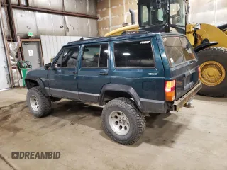1996 Jeep Cherokee Sport with VIN 1J4FJ68S1TL226495, listed as a Copart auction lot 58587685 with 205,397 mi miles and Salvage title. Bid and sale history available at DreamBid. Image 2.
