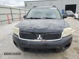 2010 Mitsubishi Endeavor LS with VIN 4A4JM2AS0AE011338, listed as a Copart auction lot 83211414 with 104,582 mi miles and Salvage Title. Bid and sale history available at carsss.com. Image 5.