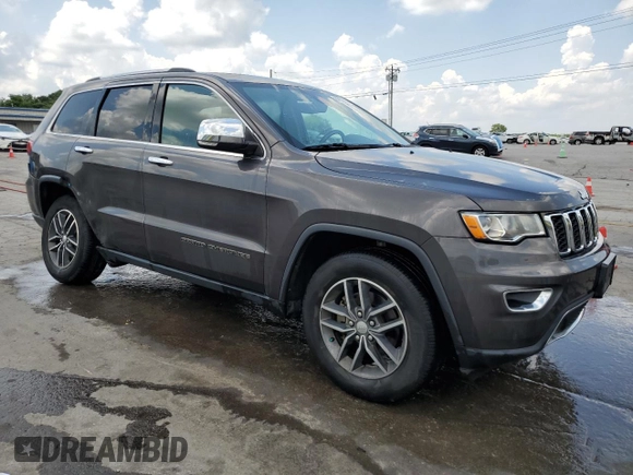 2018 Jeep Grand Cherokee Limited with VIN 1C4RJEBG1JC300335, listed as a Copart auction lot 61853325 with 107,137 mi miles and Salvage title. Bid and sale history available at DreamBid. Image 4.
