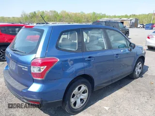 2015 Subaru Forester 2.5i with VIN JF2SJAAC0FG505980, listed as a IAAI auction lot 42010748 with 129,584 mi miles. Bid and sale history available at carsss.com. Image 4.