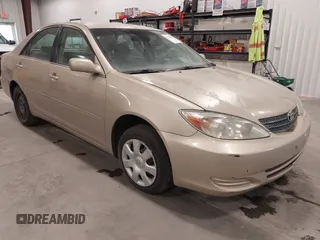 2002 Toyota Camry LE z VIN 4T1BE32K32U090486, wystawiony jako IAAI lot #41591527 z przebiegiem 188 444 mil mil oraz . Historia ofert i sprzedaży dostępna na DreamBid. Obrazek 1.