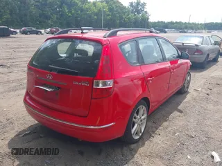 2010 Hyundai Elantra Touring SE with VIN KMHDC8AE2AU075841, listed as a IAAI auction lot 40128211 with 173,541 mi miles. Bid and sale history available at carsss.com. Image 4.