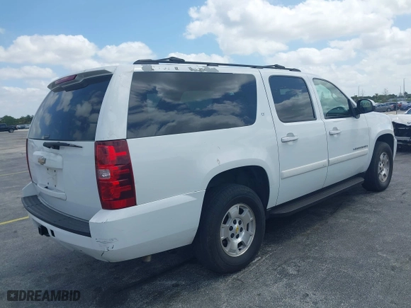2009 Chevrolet Suburban LT w/2LT with VIN 1GNFC26JX9J108623, listed as a IAAI auction lot 42115456 with 144,370 mi miles. Bid and sale history available at carsss.com. Image 4.