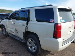 2015 Chevrolet Tahoe LTZ with VIN 1GNSCCKC2FR140524, listed as a IAAI auction lot 41592878 with 284,785 mi miles. Bid and sale history available at carsss.com. Image 3.