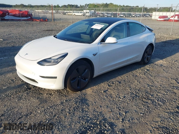 2019 Tesla Model 3 Mid Range z VIN 5YJ3E1EA8KF464681, wystawiony jako IAAI lot #42072104 z przebiegiem 83 451 mil mil oraz . Historia ofert i sprzedaży dostępna na DreamBid. Obrazek 2.