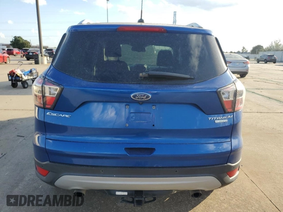 2017 Ford Escape Titanium with VIN 1FMCU0JD2HUB21261, listed as a Copart auction lot 76607264 with 130,796 mi miles and Salvage Title. Bid and sale history available at carsss.com. Image 6.