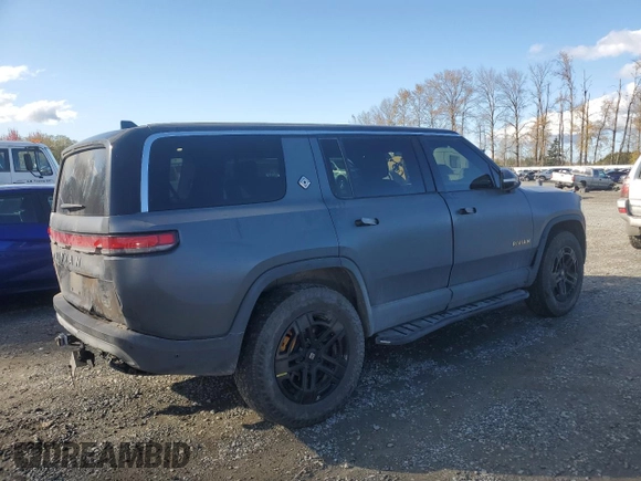 2022 Rivian R1S Launch Edition with VIN 7PDSGABL1NN000514, listed as a Copart auction lot 77444184 with 29,490 mi miles and Salvage Title. Bid and sale history available at DreamBid. Image 3.