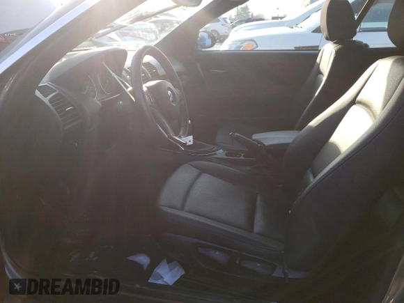 2009 BMW 1 Series 128i with VIN WBAUN13569VH80991, listed as a Copart auction lot 43225685 with 104,652 mi miles and Salvage Title. Bid and sale history available at DreamBid. Image 7.