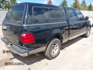 2003 Ford F-150 XLT with VIN 1FTRW07613KC71609, listed as a IAAI auction lot 42186741 with 190,591 mi miles. Bid and sale history available at carsss.com. Image 4.