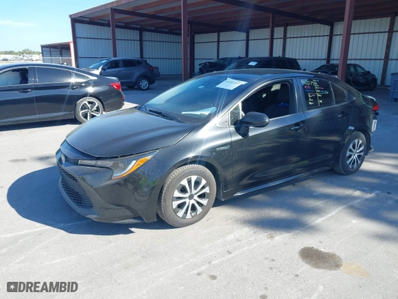 2020 Toyota Corolla Hybrid LE with VIN JTDEBRBE1LJ018888, listed as a IAAI auction lot 41697257 with 110,081 mi miles. Bid and sale history available at carsss.com. Image 19.
