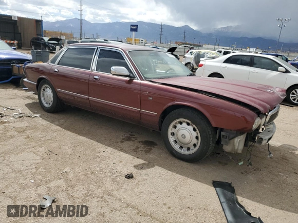 1998 Jaguar XJ Vanden Plas with VIN SAJKX6245WC830912, listed as a Copart auction lot 49717285 with 127,509 mi miles and Salvage Title. Bid and sale history available at DreamBid. Image 4.
